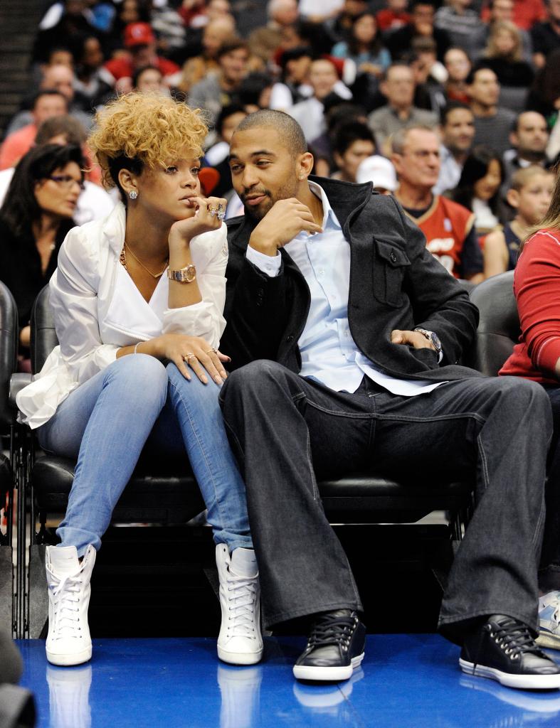 Rihanna and Matt Kemp sitting courtside at a basketball game.