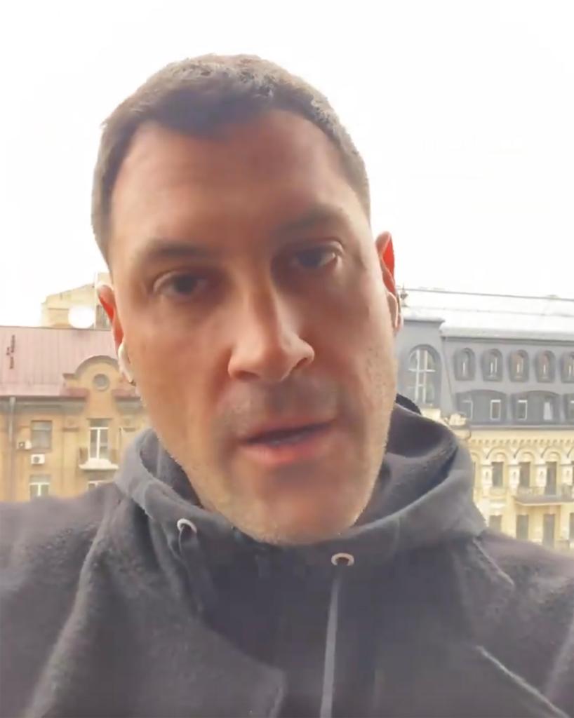 A screenshot of Maksim Chmerkovskiy talking in an Instagram video on a balcony in Ukraine.