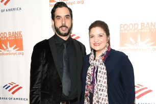 Alex Guarnaschelli and her fiancé Michael Castellon on a red carpet in 2019.