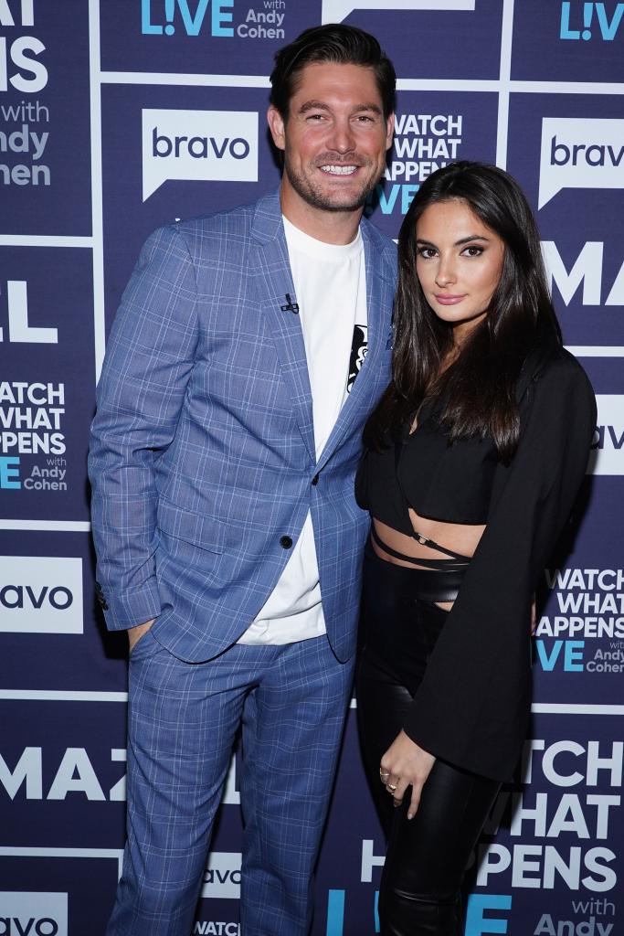 Craig Conover and Paige DeSorbo posing for a red carpet event