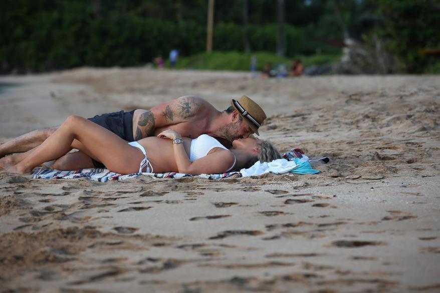 Brian Austin Green kisses Sharna Burgess.