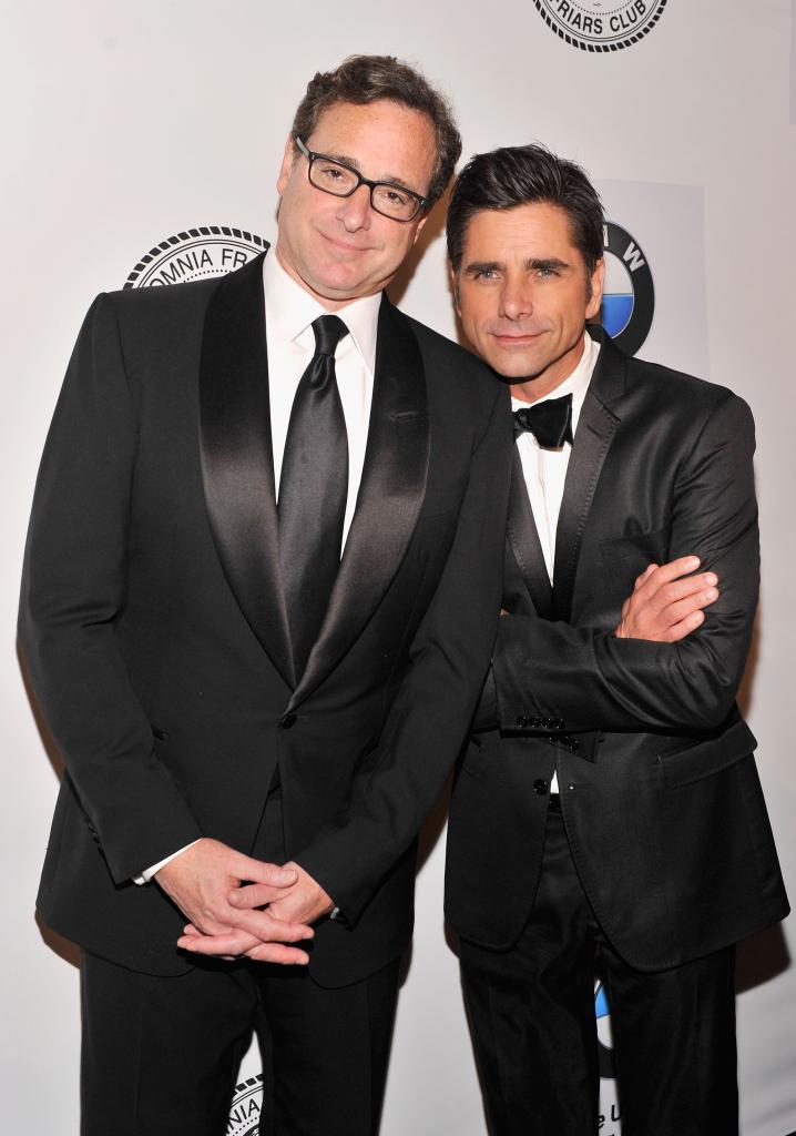 John Stamos and Bob Saget on a red carpet in June 2013.