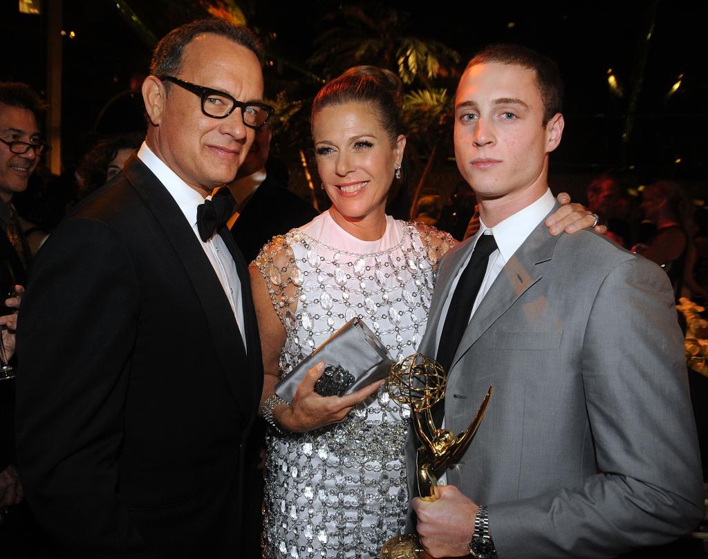 Tom Hanks, Rita Wilson and Chet Hanks posing together at an event.