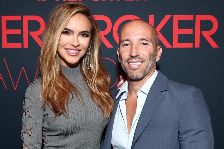 Chrishell Stause and Jason Oppenheim on a red carpet in September 2021.