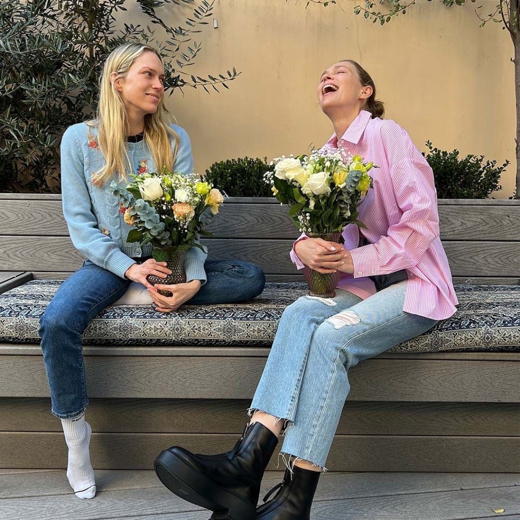 Erin and Sara Foster holding flowers