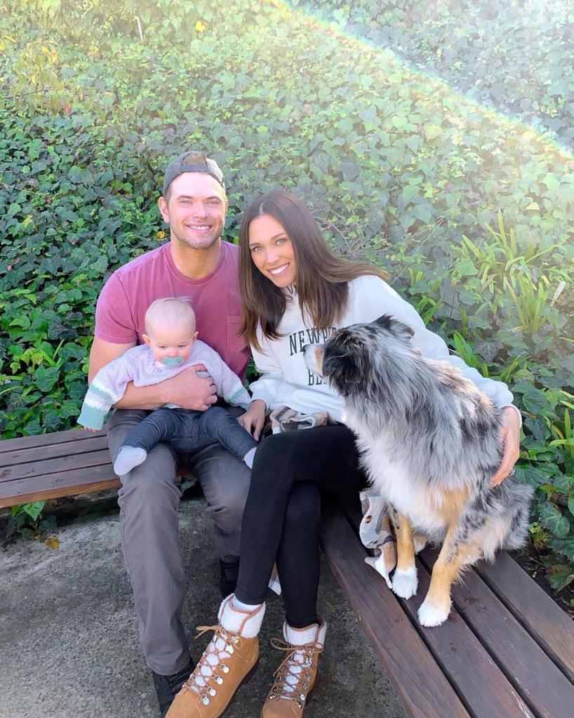 Kellan Lutz and his wife Brittany Gonzales posing together with their dog ane baby