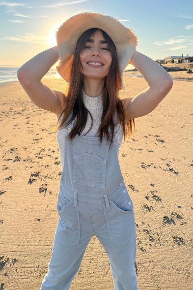 Frilly Lily: Lily Collins shows that happiness is in the air today during a day at the beach.