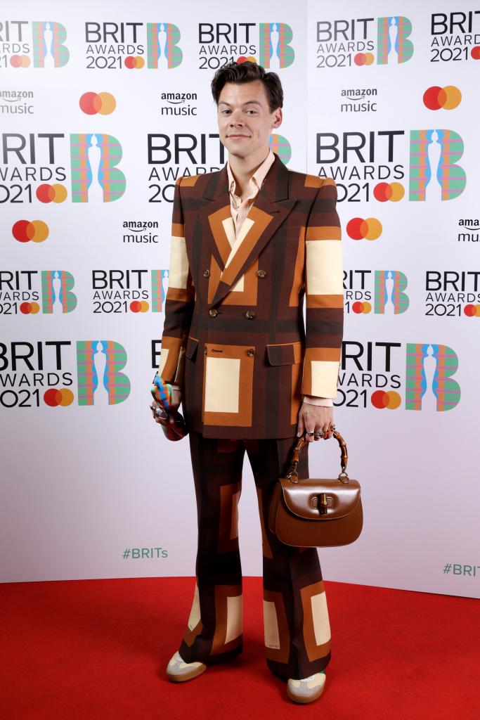 Harry Styles wearing a brown suit