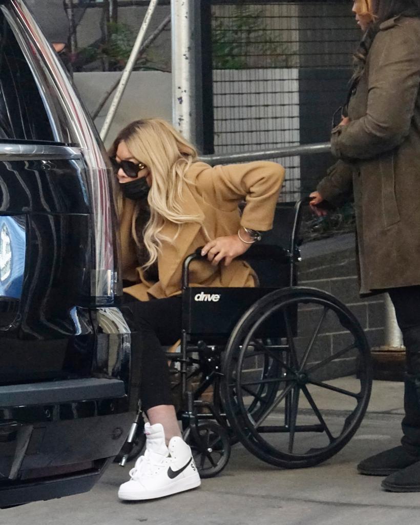 Wendy Williams sitting in a wheelchair.