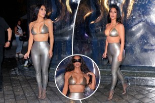 Kim Kardashian in silver bra top and leggings