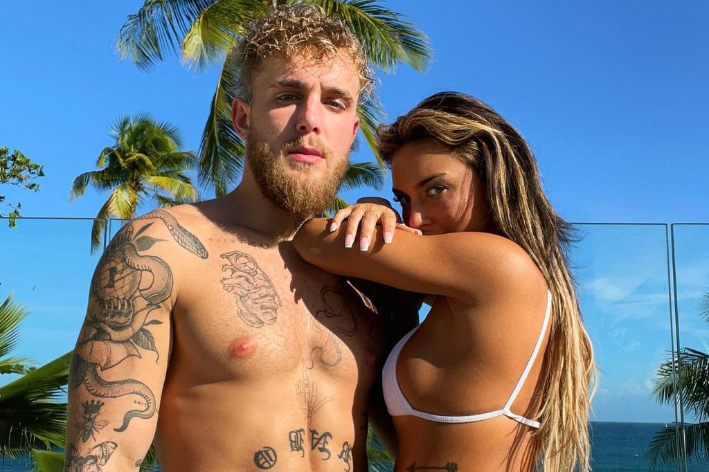 Jake Paul and Julia Rose pose together in a tropical setting