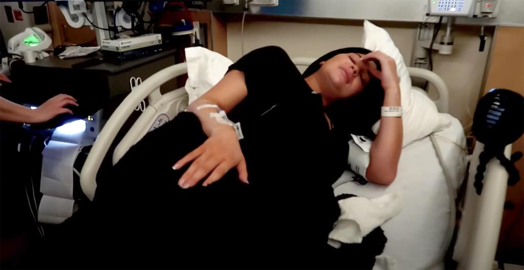 Kylie Jenner lies in a hospital bed, awaiting the birth of her son, Wolf Webster