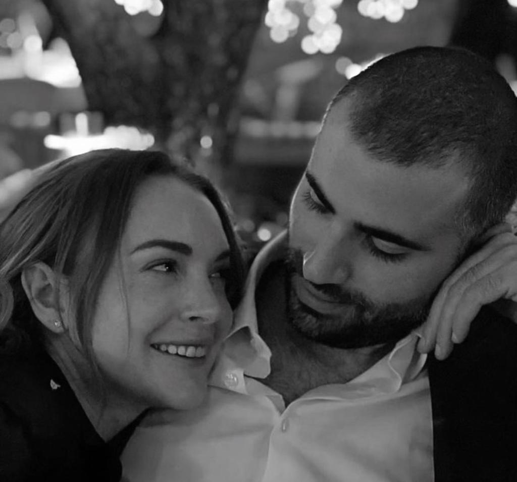 A black-and-white photo of Lindsay Lohan and Bader Shammas smiling