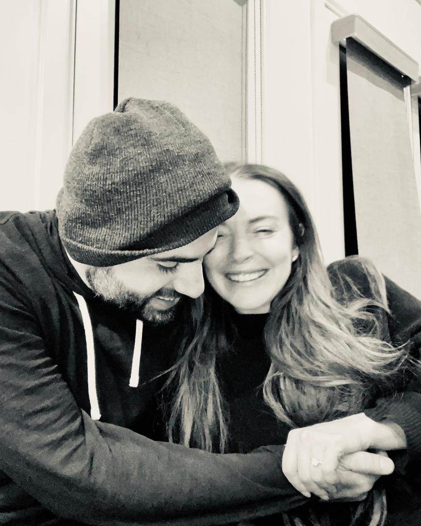 A black-and-white photo of Lindsay Lohan and Bader Shammas smiling