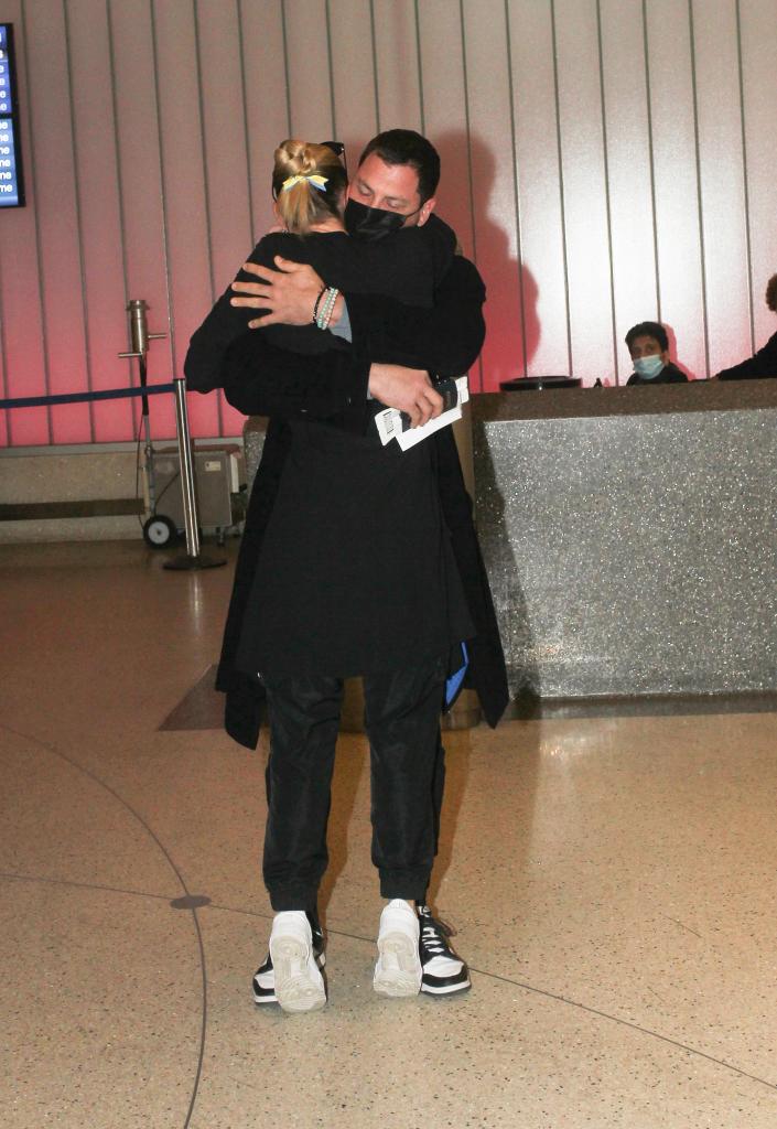 Maksim Chmerkovskiy and Peta Murgatroyd hugging.