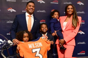 Ciara and her family wear matching orange outfits