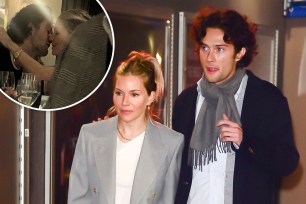 Sienna Miller was seen smooching presumed new beau Oli Green at dinner.