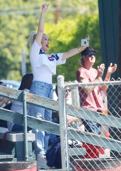 Gwen Stefani cheers in the stands