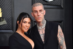 Travis Barker and Kourtney Kardashian at 2022 Grammys