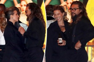 Jason Momoa and Kate Beckinsale talking at an Oscars afterparty.