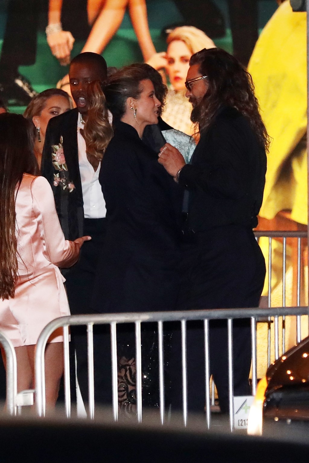 Jason Momoa and Kate Beckinsale talking at an Oscars afterparty.