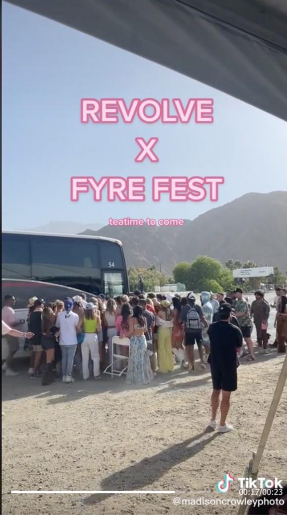 A screenshot of a TikTok video showing a people in line to board a bus.