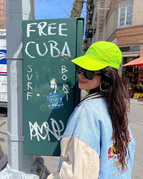 Camila Cabello stands near a "free Cuba" mark.
