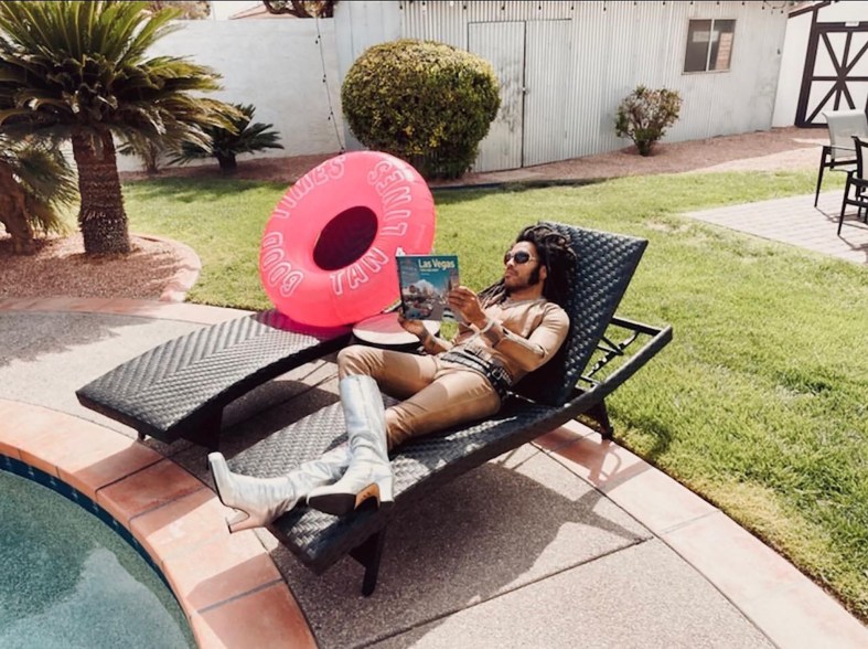 Shirtless Lenny Kravitz lounges