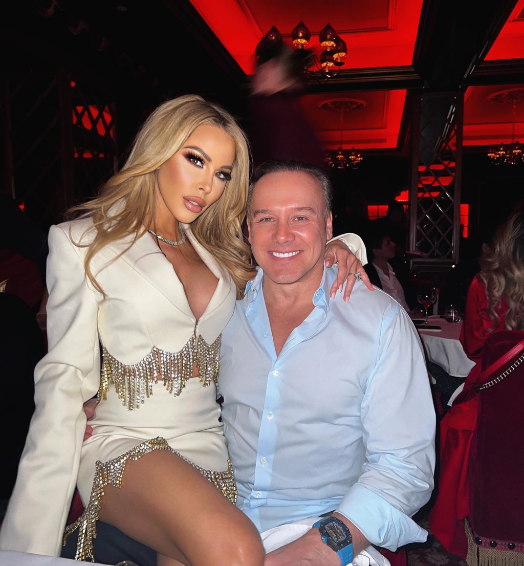 Lisa Hochstein sitting on Lenny Hochstein's lap.