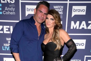 Luis Ruelas and Teresa Giudice posing together at "Watch What Happens Live with Andy Cohen."