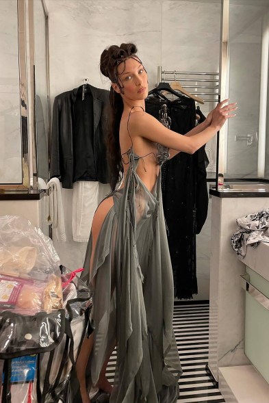 Beauty and the booty tooch: Bella Hadid uses the Tyra Banks-coined modeling technique in a 2004 Jean Paul Gaultier ensemble.