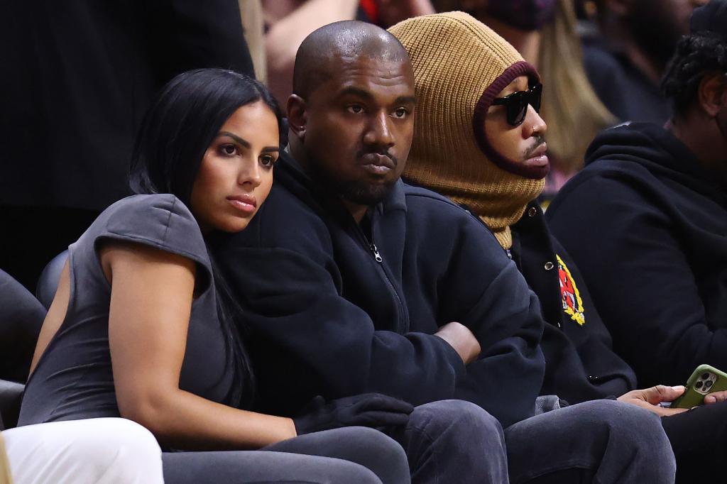 Chaney Jones and Kanye West watching a game together