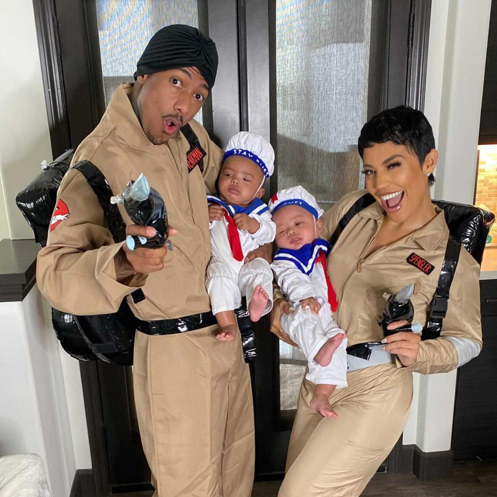 Nick Cannon and Abby De La Rosa holding their twins, Zion and Zillion.