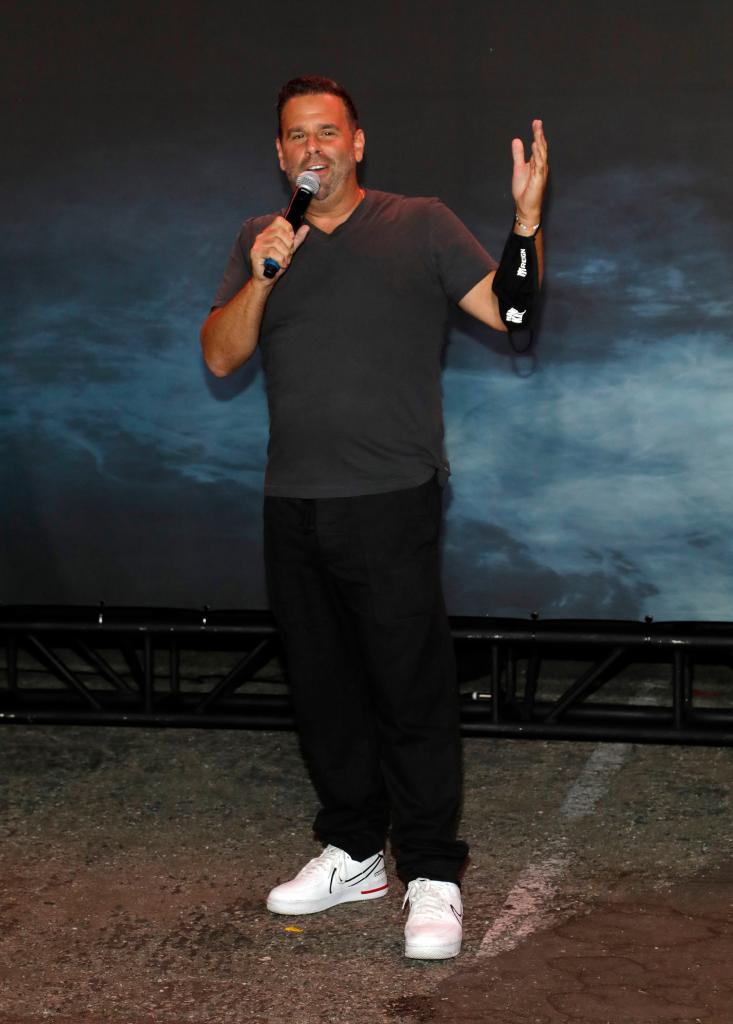 Randall Emmett speaking with a microphone in his hand.