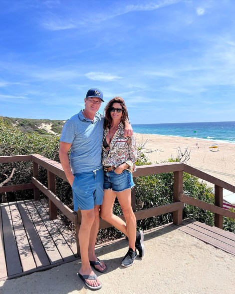 Cindy Crawford and Rande Gerber pose on the boardwalk.