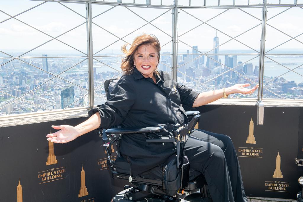 Abby Lee Miller sitting in a wheelchair.