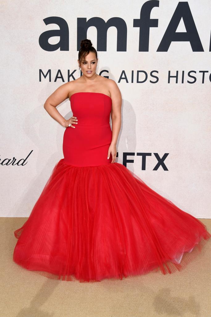 Ashley Graham in a red dress on a red carpet.