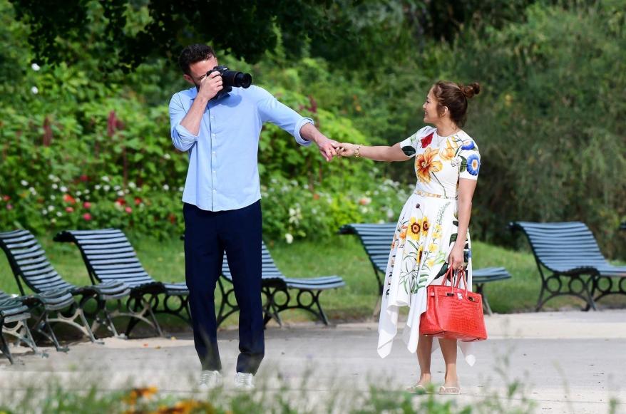 Ben Affleck taking photos of Jennifer Lopez.