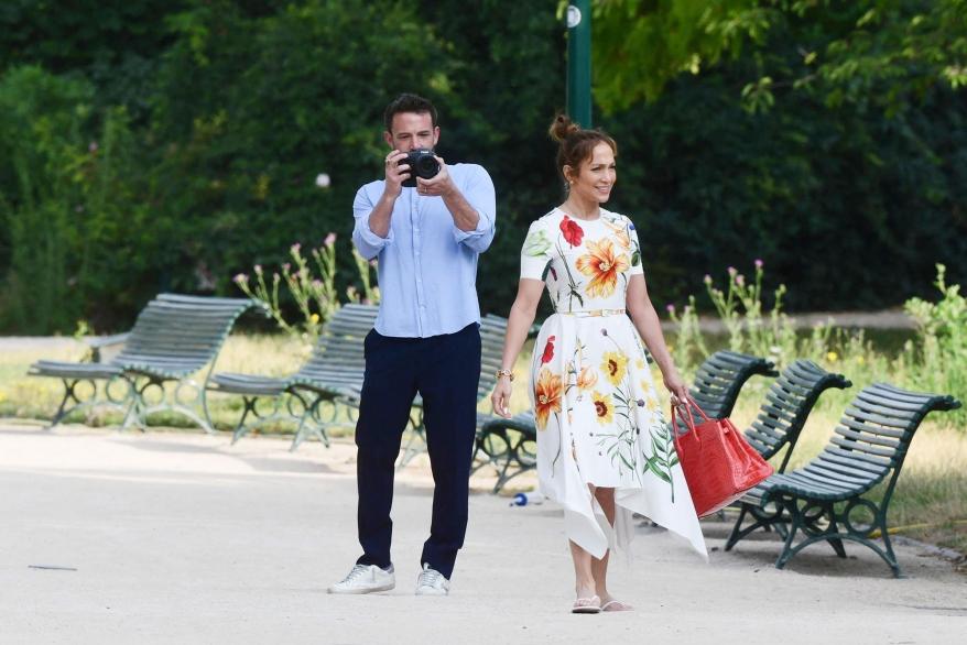 Ben Affleck taking photos of Jennifer Lopez.