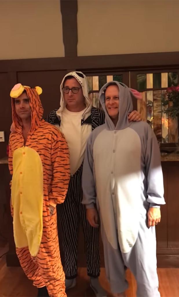 Bob Saget, Dave Coulier and John Stamos wearing animal costumes.