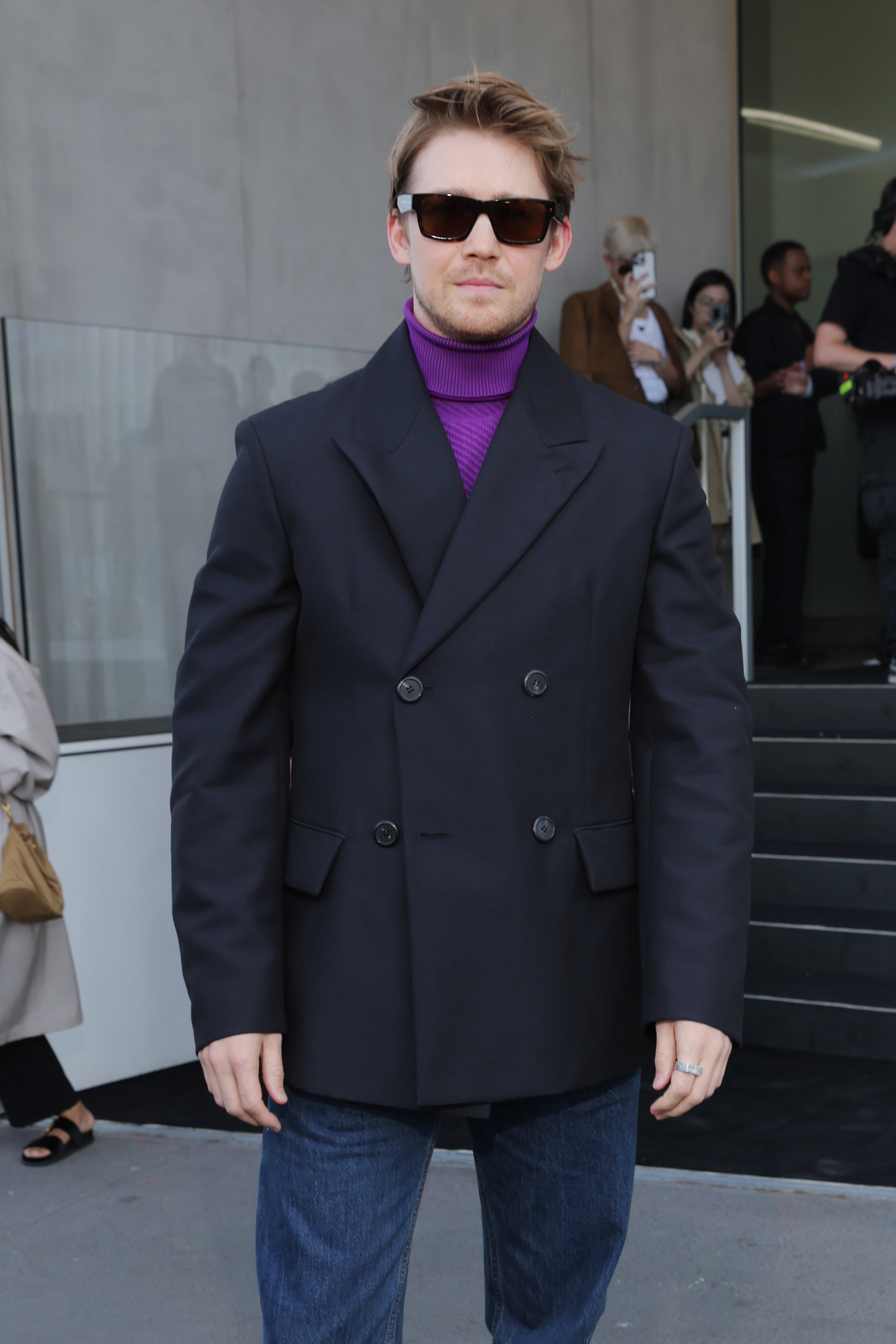 Joe Alwyn posing on a carpet