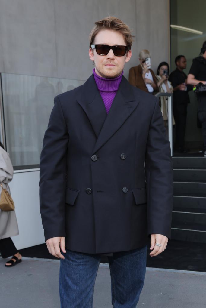 Joe Alwyn posing on a carpet