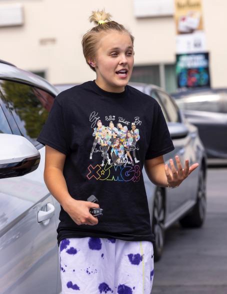 JoJo Siwa filling up her car's tank at the gas station