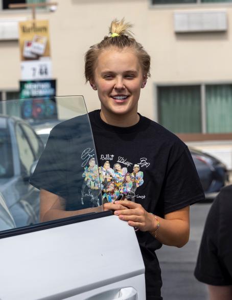 JoJo Siwa filling up her car's tank at the gas station