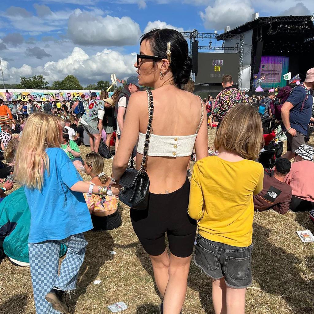 Lily Allen at a music festival with her two daughters, Marnie and Ethel.