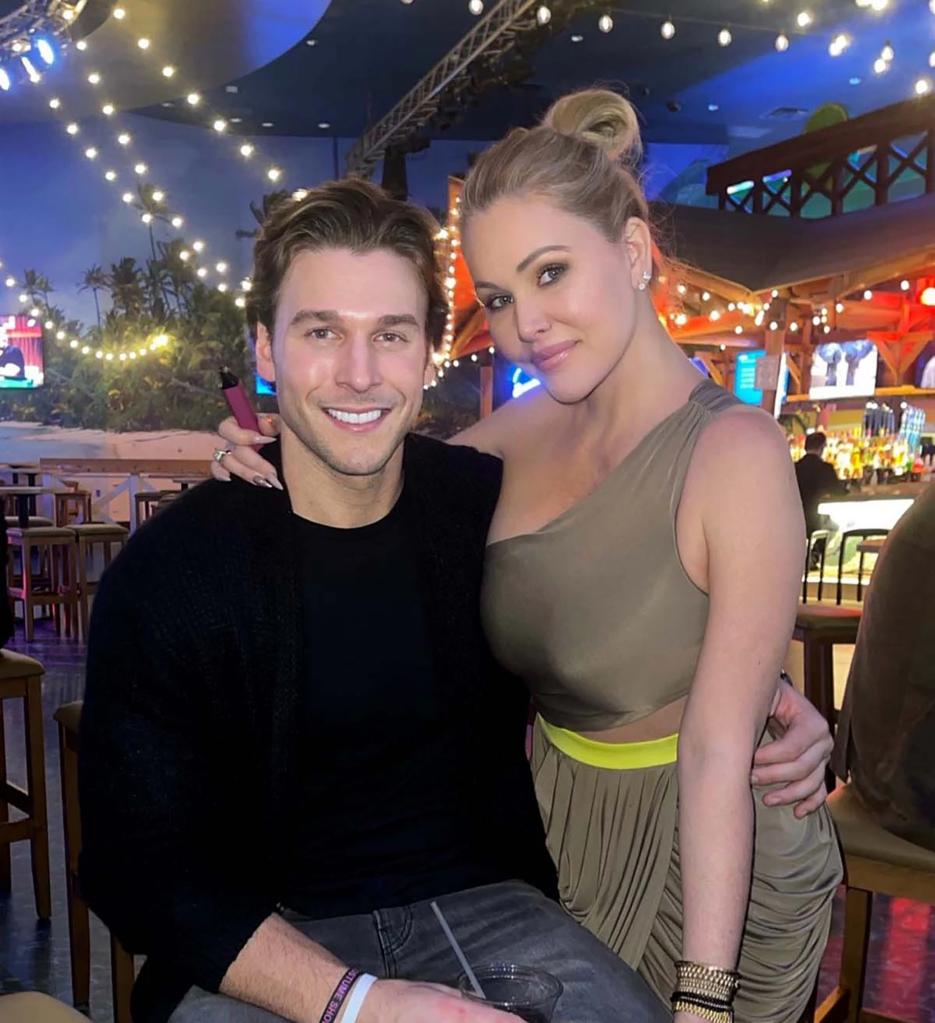 Matthew Rondeau and Shanna Moakler posing together in a restaurant.