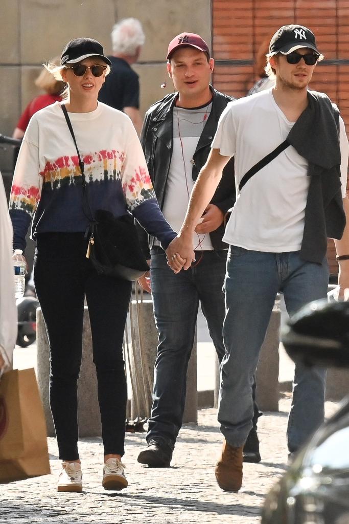 Taylor Swift and Joe Alwyn holding hands in Paris.