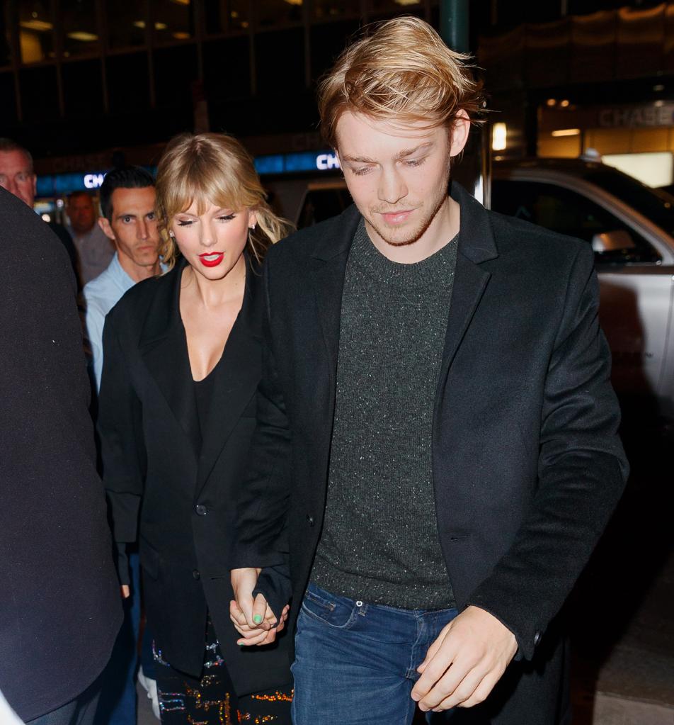 Taylor Swift and Joe Alwyn holding hands in 2019.