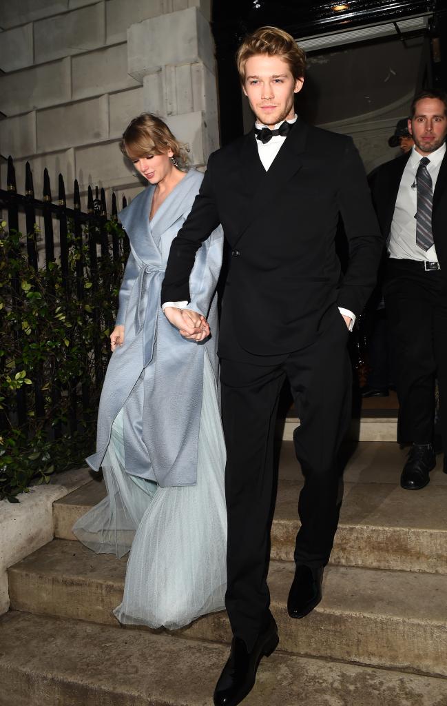 Taylor Swift and Joe Alwyn holding hands after the BAFTA's. 