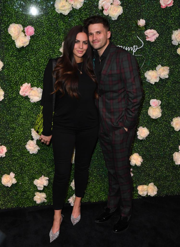Katie Maloney and Tom Schwartz posing for a red carpet together
